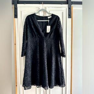 Beautiful and elegant black lace evening dress. Knee length.